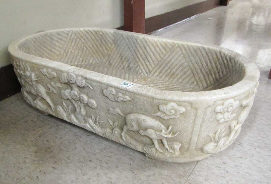 Appraisal: CHINESE RELIEF-CARVED MARBLE BASIN oval shape the sides decorated with