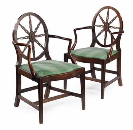 Appraisal: A pair of George III mahogany armchairs the oval backs