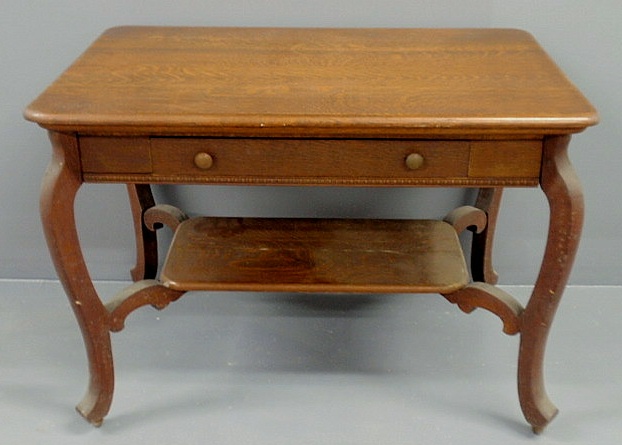 Appraisal: Oak library table c with a single drawer and lower