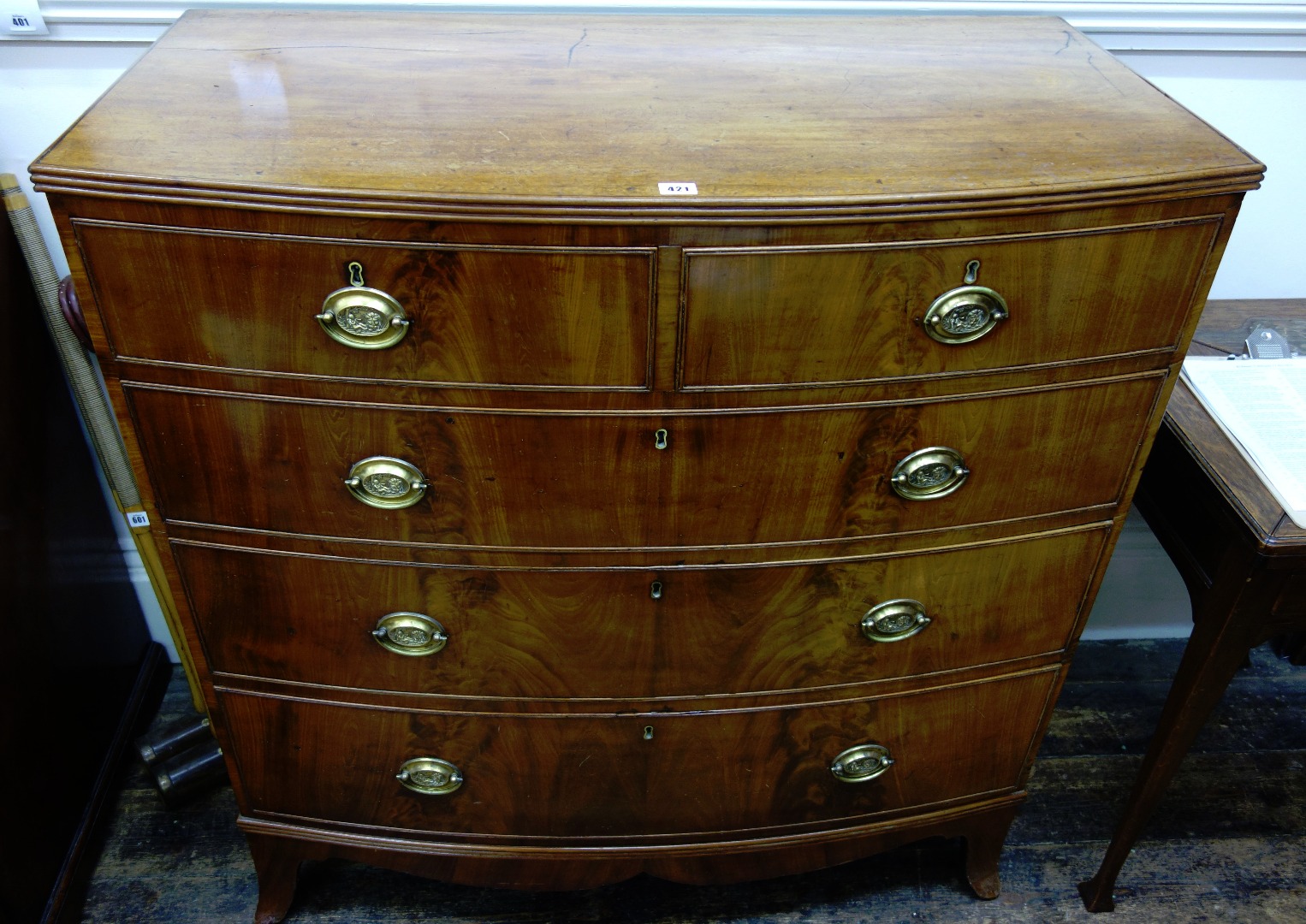 Appraisal: A tall George III mahogany bowfront chest with moulded edge