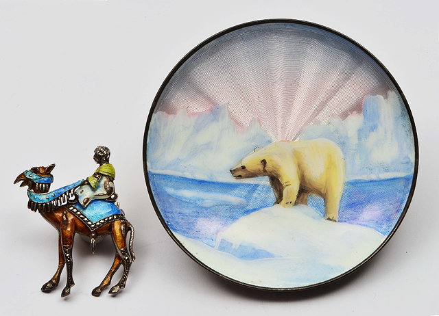 Appraisal: white metal open dishwith polychrome enamelled decoration showing a polar