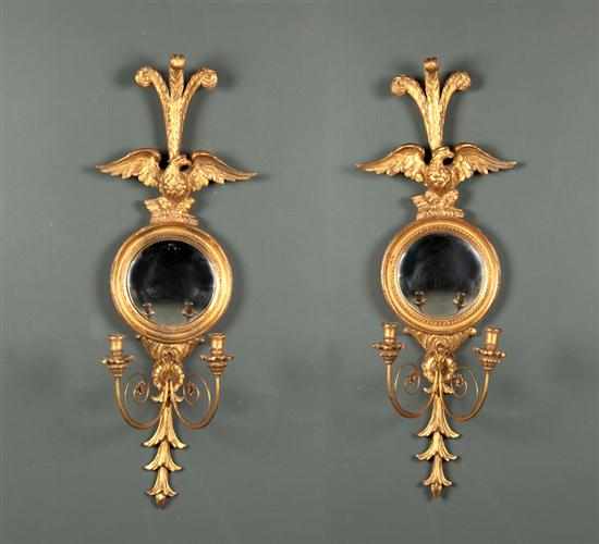 Appraisal: Pair of Regency style carved giltwood two-light mirrored sconces th