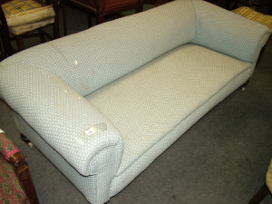 Appraisal: A blue upholstered Chesterfield style sofa with rounded back and