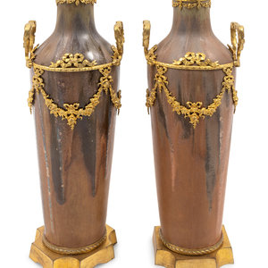 Appraisal: A Pair of Louis XVI Style Gilt-Metal-Mounted Pottery Vases Height