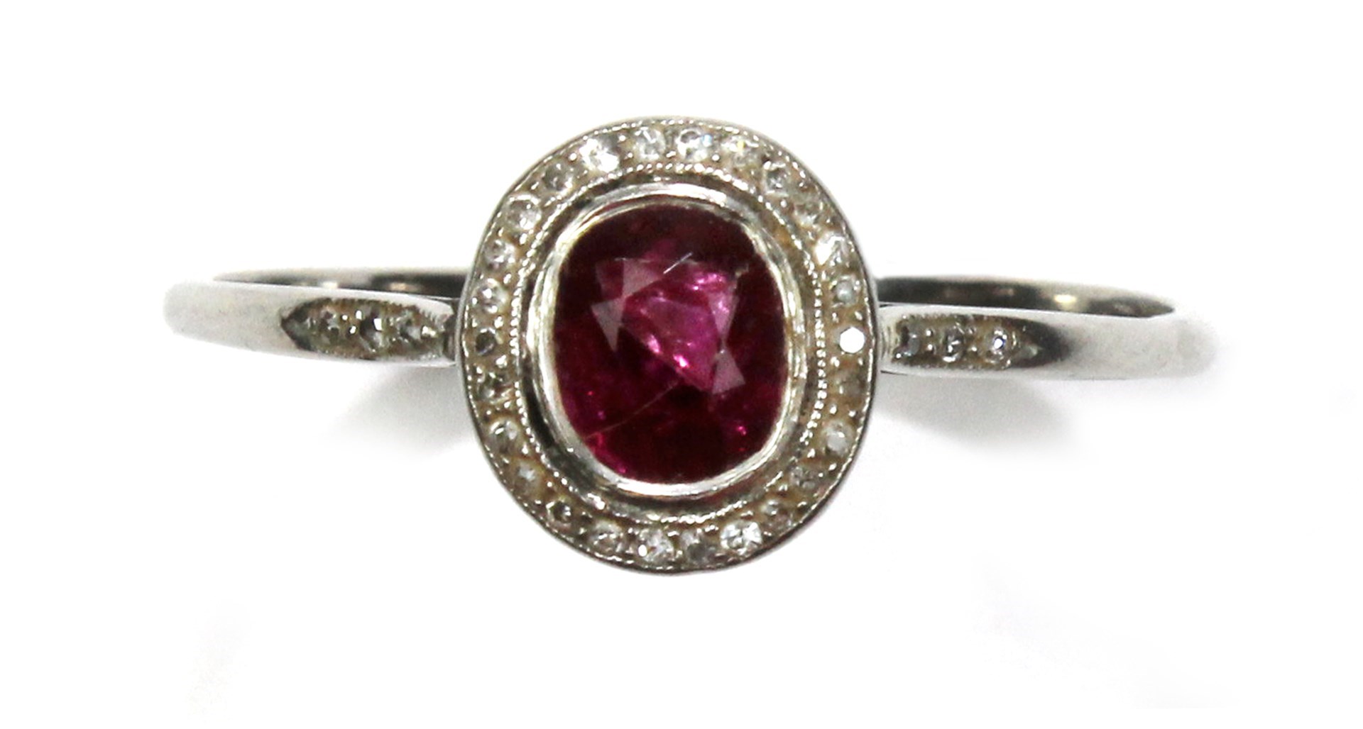 Appraisal: A ruby and diamond set cluster ring mounted with the