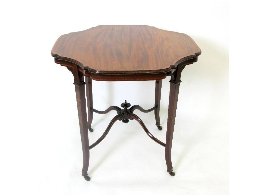 Appraisal: An Edwardian mahogany inlaid window table the shaped top raised