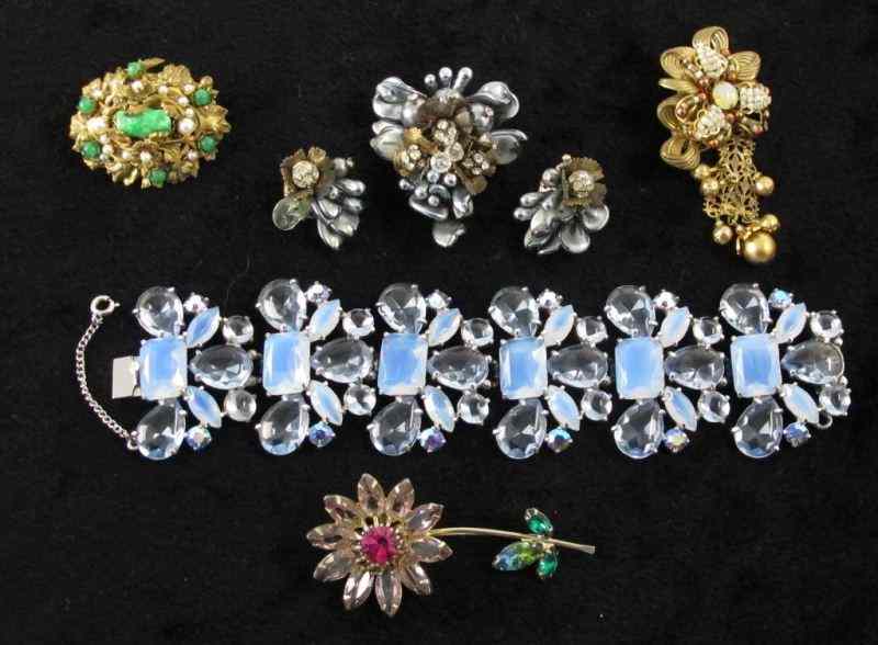 Appraisal: Six Pieces of Signed Costume Jewelrythe first a floral brooch