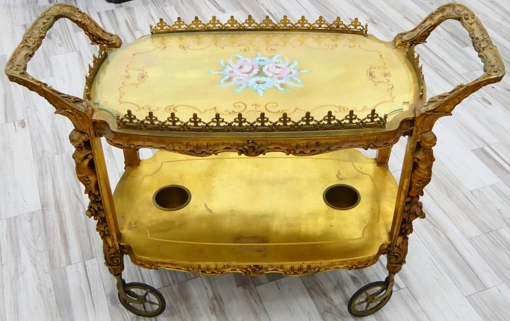 Appraisal: NOUVEAU FLORENTINE CARVED PAINTED ROLLING TEA CART Incredible turn of