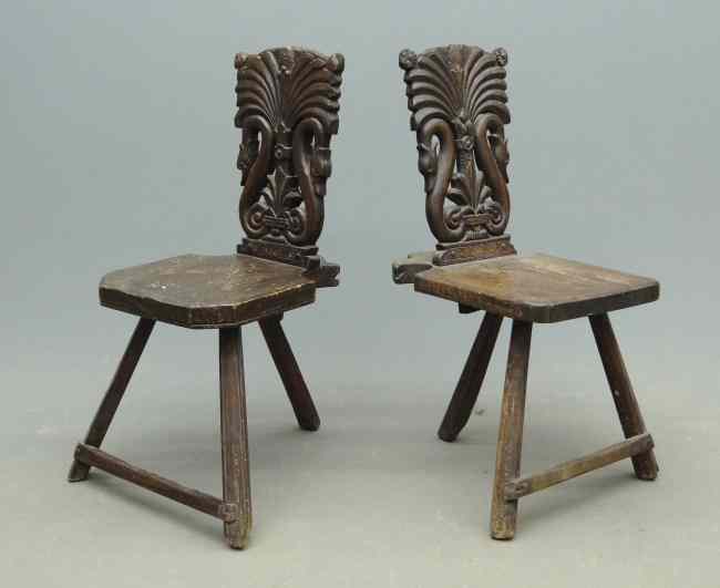 Appraisal: Pair th c tri-leg Continental carved chairs dated and ''