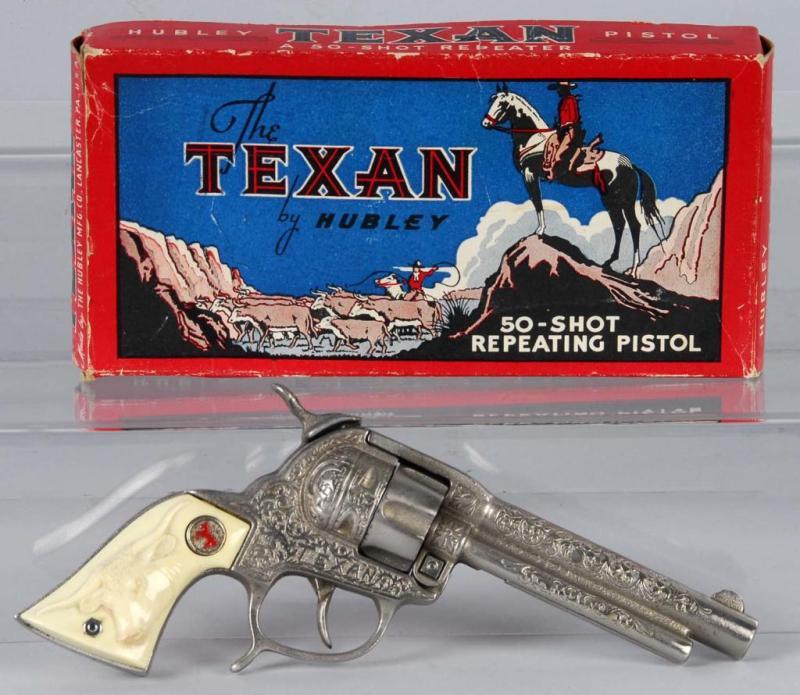 Appraisal: Cast Iron Hubley Texan Cap Gun Description Includes box Toy