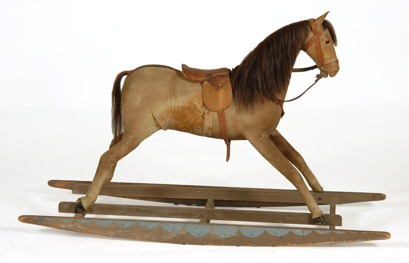 Appraisal: HIDE-COVERED ROCKING HORSE Late th Early th CenturyWith brown saddle