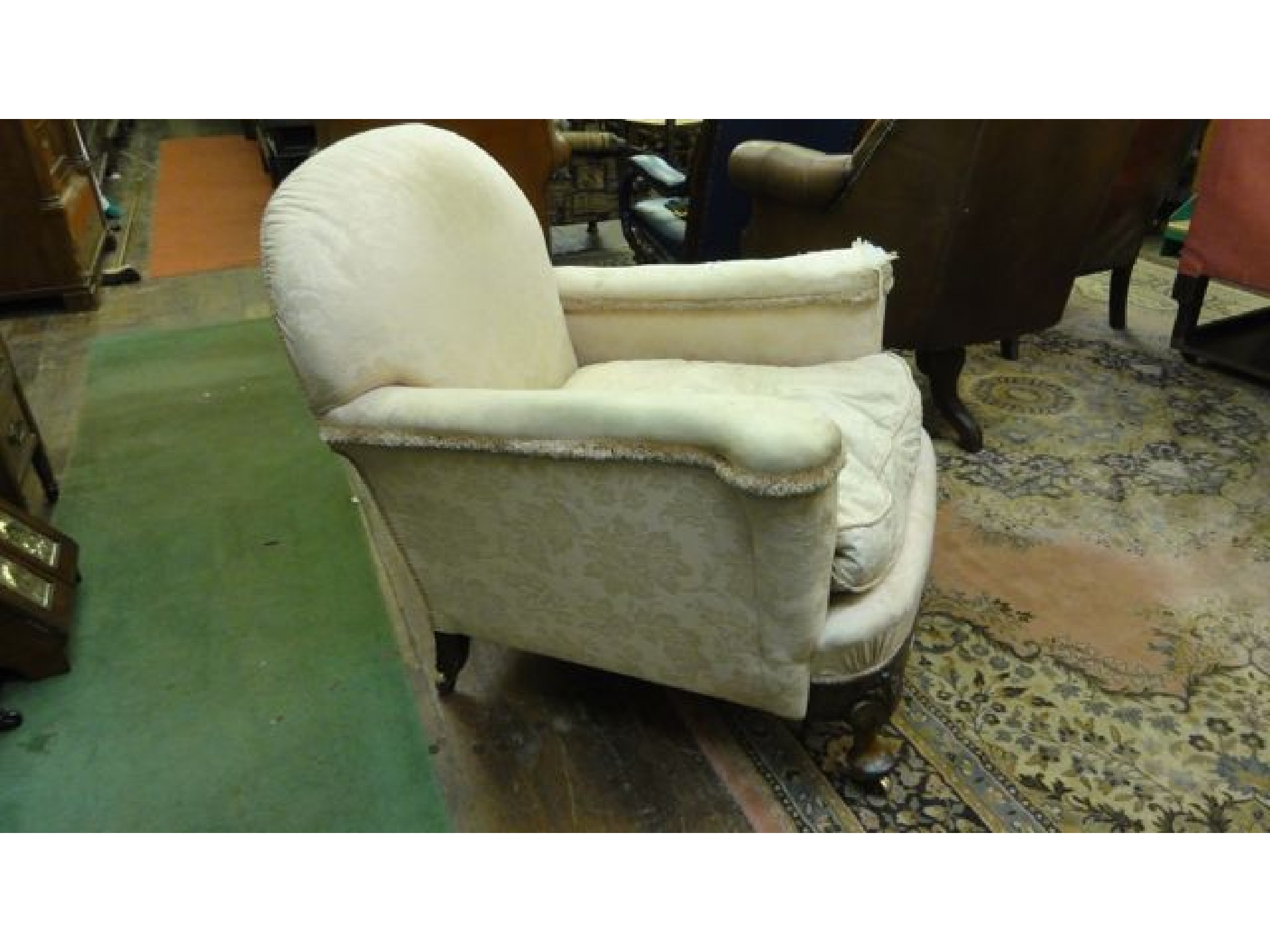 Appraisal: A substantial Edwardian drawing room chair with arched back and