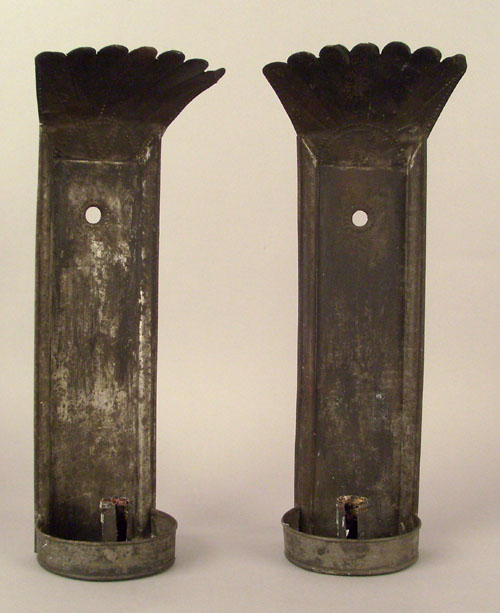 Appraisal: Pair of tinned sheet iron wall sconces ca with punched