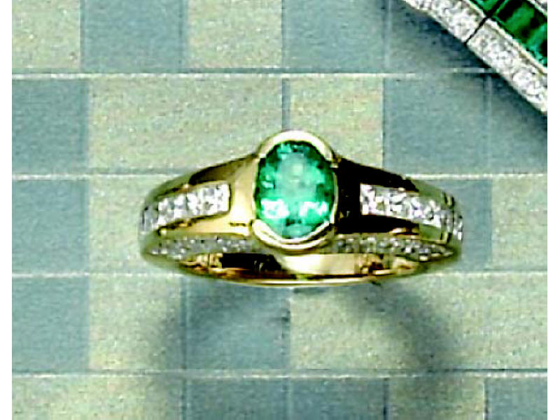 Appraisal: EMERALD AND DIAMOND RING k yellow gold ring with bezel