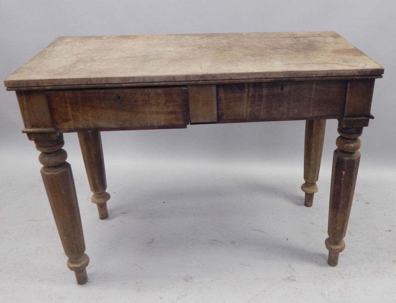 Appraisal: A Victorian mahogany serving table with two frieze drawers on