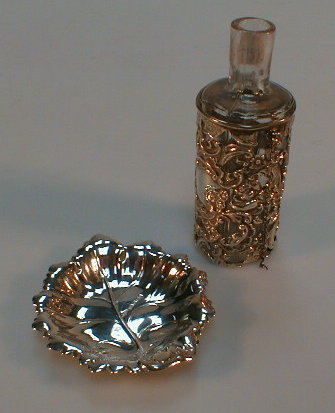 Appraisal: A silver cased bottle Chester hallmark together with a silver