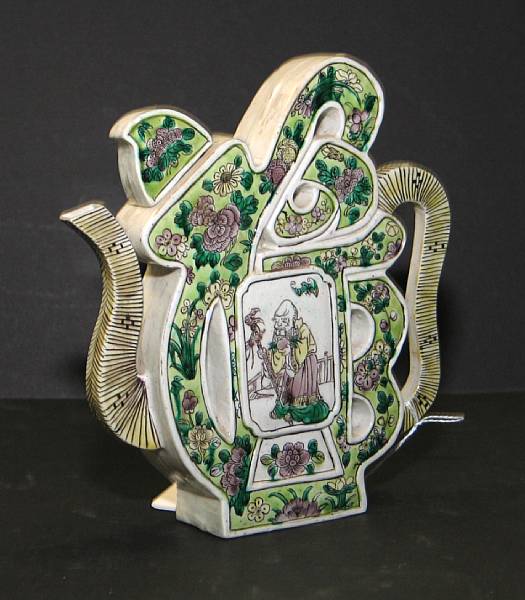 Appraisal: A famille verte enameled porcelain wine pot Molded in the