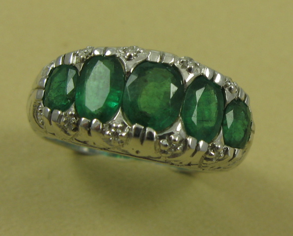 Appraisal: EMERALD DIAMOND AND FOURTEEN KARAT GOLD RING set with five