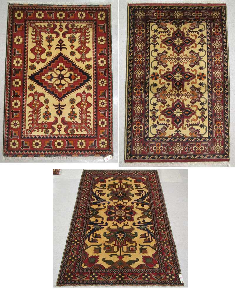 Appraisal: THREE SIMILAR HAND KNOTTED ORIENTAL AREA RUGS geometric and curvilinear