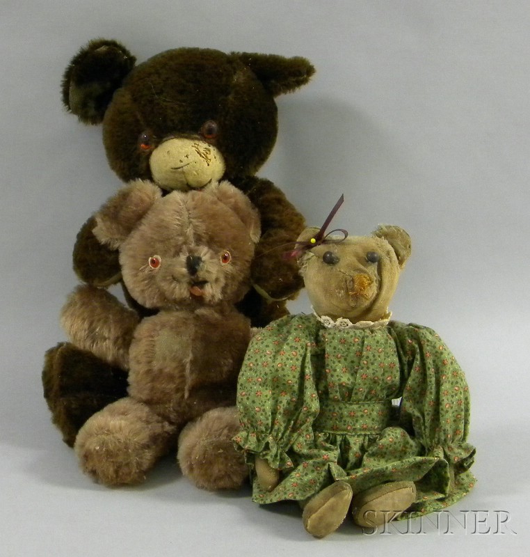 Appraisal: Three Teddy Bears a small light brown a dark brown