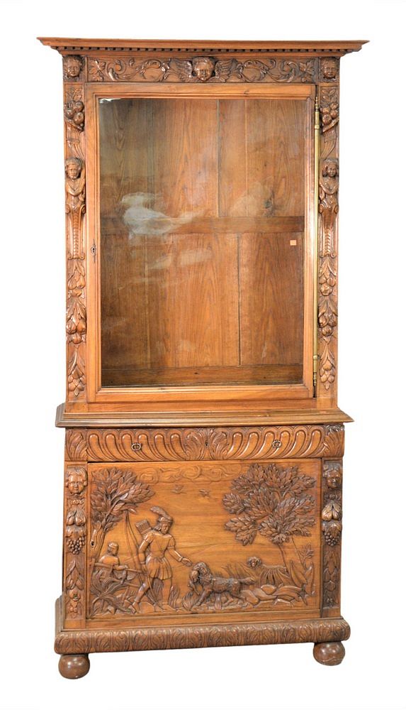 Appraisal: Continental Walnut Cabinet in two parts having carved putti figures