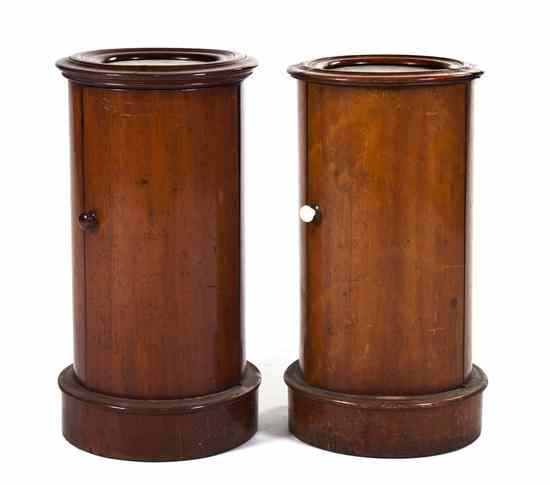 Appraisal: A Pair of Biedermeier Style Pedestal Cabinets having a circular