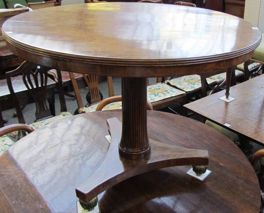 Appraisal: A th century mahogany centre table the circular snap top