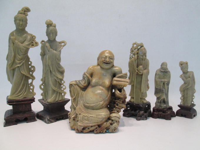 Appraisal: SIX CHINESE SOAPSTONE FIGURES the first a seated Buddha holding