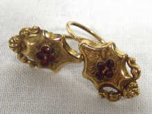 Appraisal: A pair of th century gold garnet set earrings