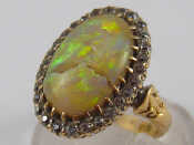 Appraisal: A yellow metal tests carat gold opal and diamond ring