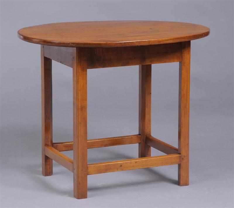 Appraisal: AMERICAN CHIPPENDALE MAPLE OVAL-TOP TAVERN TABLE The overhang top on