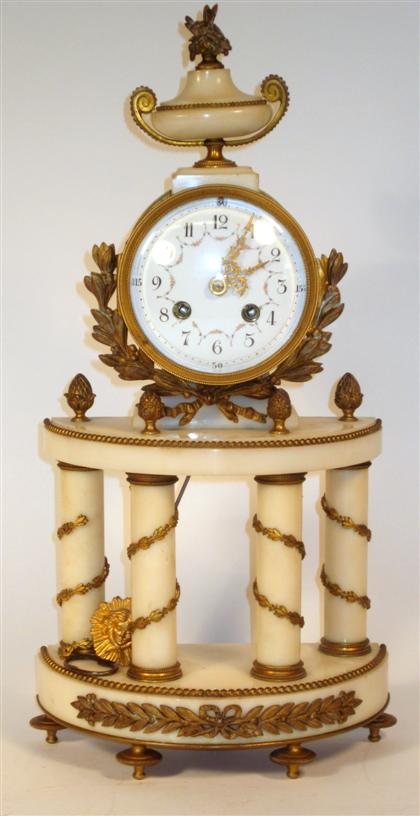 Appraisal: French Empire style gilt metal mounted alabaster mantle clock early