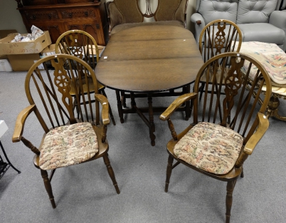 Appraisal: Oak drop leaf table and four matching wheel back chairs