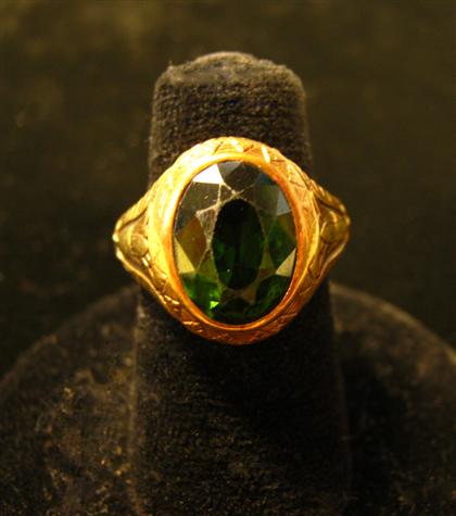 Appraisal: karat gold and green tourmaline ringOval faceted tourmaline set in