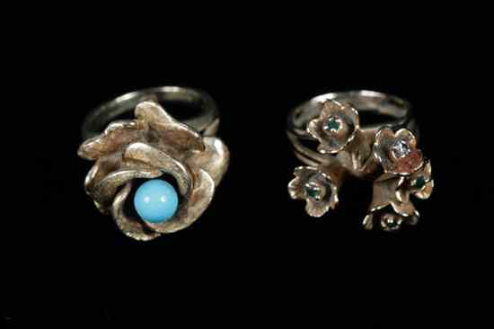 Appraisal: TWO K YELLOW GOLD AND GEMSTONE FLORAL DESIGN RINGS One