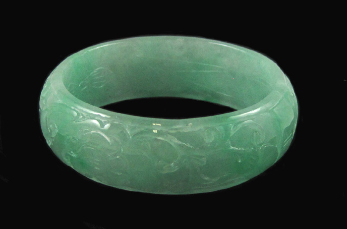 Appraisal: CHINESE CARVED LIGHT GREEN JADE BANGLE weighing grams and measuring