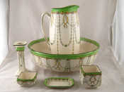 Appraisal: A ceramic Doulton washstand set of jug and bowl soapdish