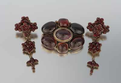 Appraisal: A Vintage Garnet Brooch and Earrings Silver mounted brooch features