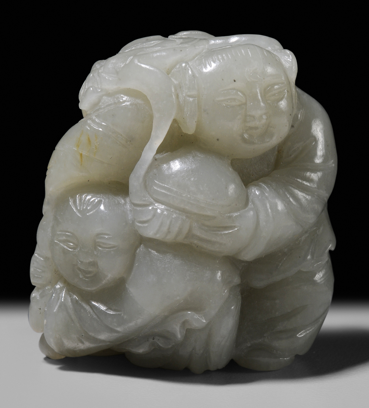 Appraisal: Jade Figural Group Qing Dynasty celadon jade with one russet