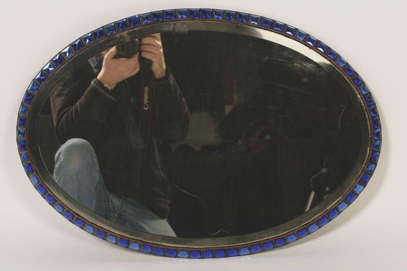 Appraisal: A GEORGE III STYLE OVAL BEVEL EDGED WALL MIRROR with