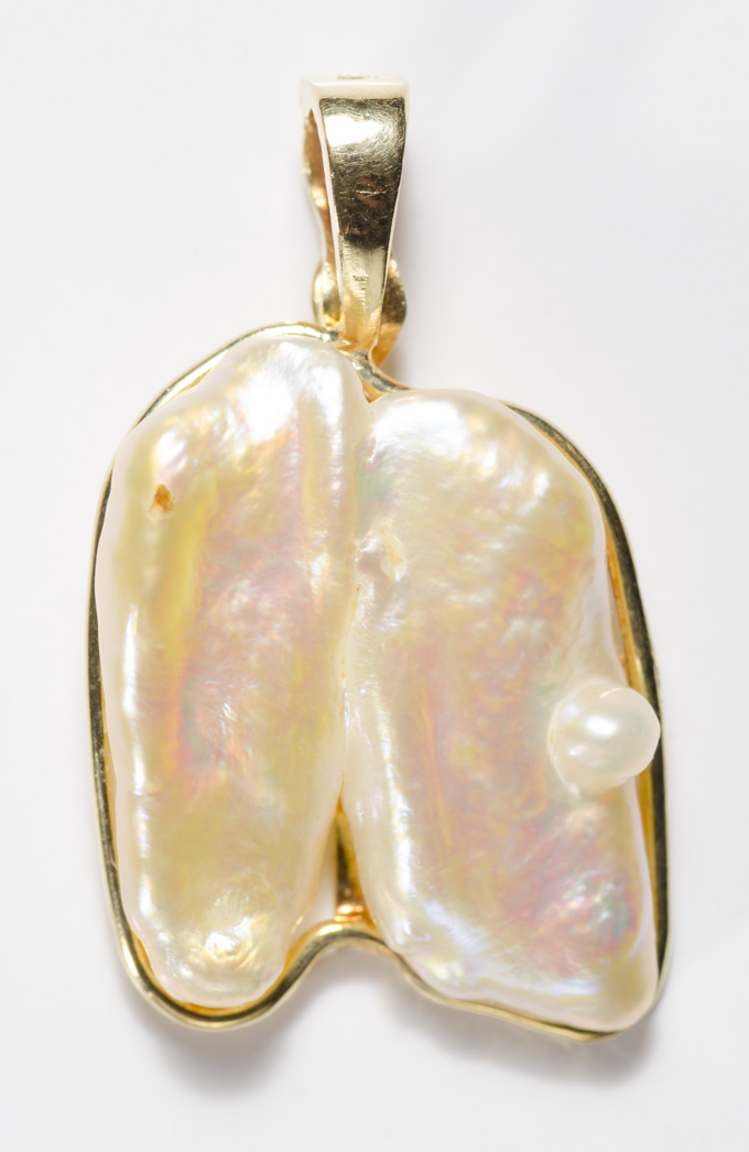 Appraisal: BAROQUE PEARL AND FOURTEEN KARAT GOLD PENDANT with a large