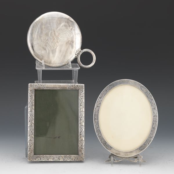 Appraisal: THREE ART NOUVEAU STERLING SILVER VANITY MIRROR AND PICTURE FRAMES