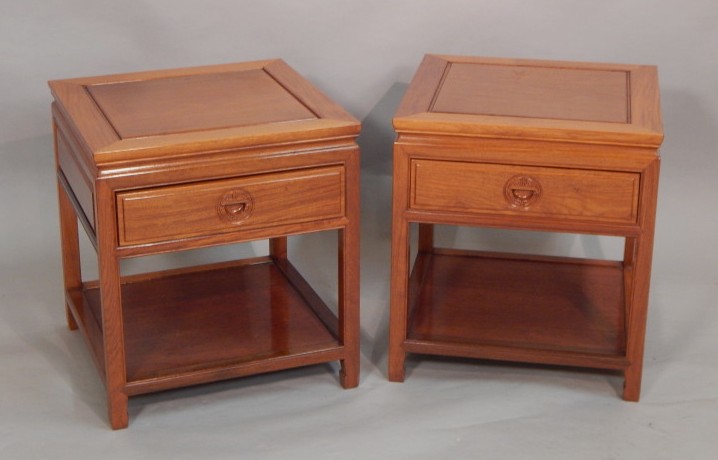 Appraisal: A pair of Chinese hardwood side tables each with a