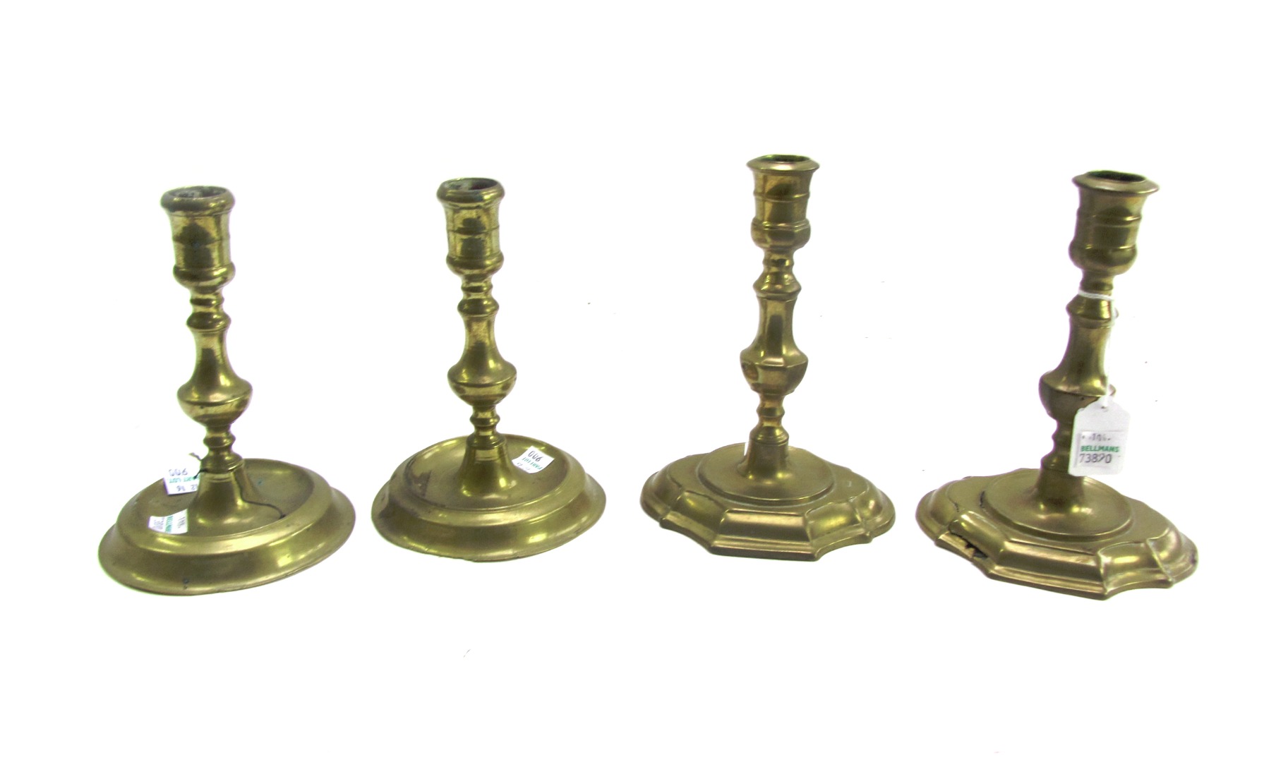 Appraisal: A pair of early Queen Anne brass baluster candlesticks with