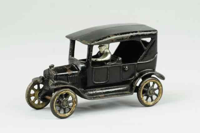 Appraisal: FORD TOURING SEDAN Arcade cast iron painted in black overall