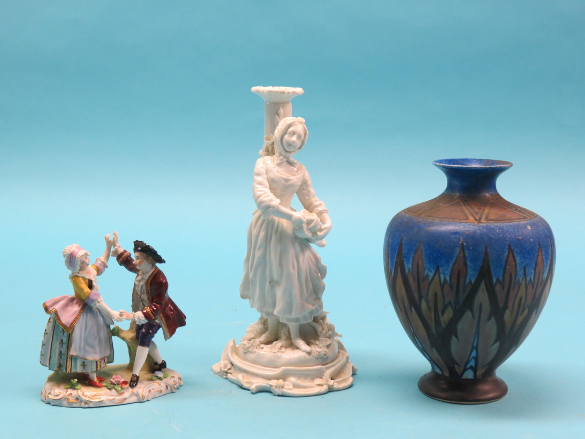 Appraisal: A th century German porcelain candlestick figure in a Sitzendorf