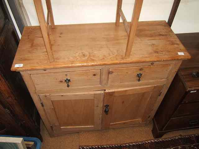 Appraisal: AN OLD PINE KITCHEN SIDE TABLE fitted two drawers with