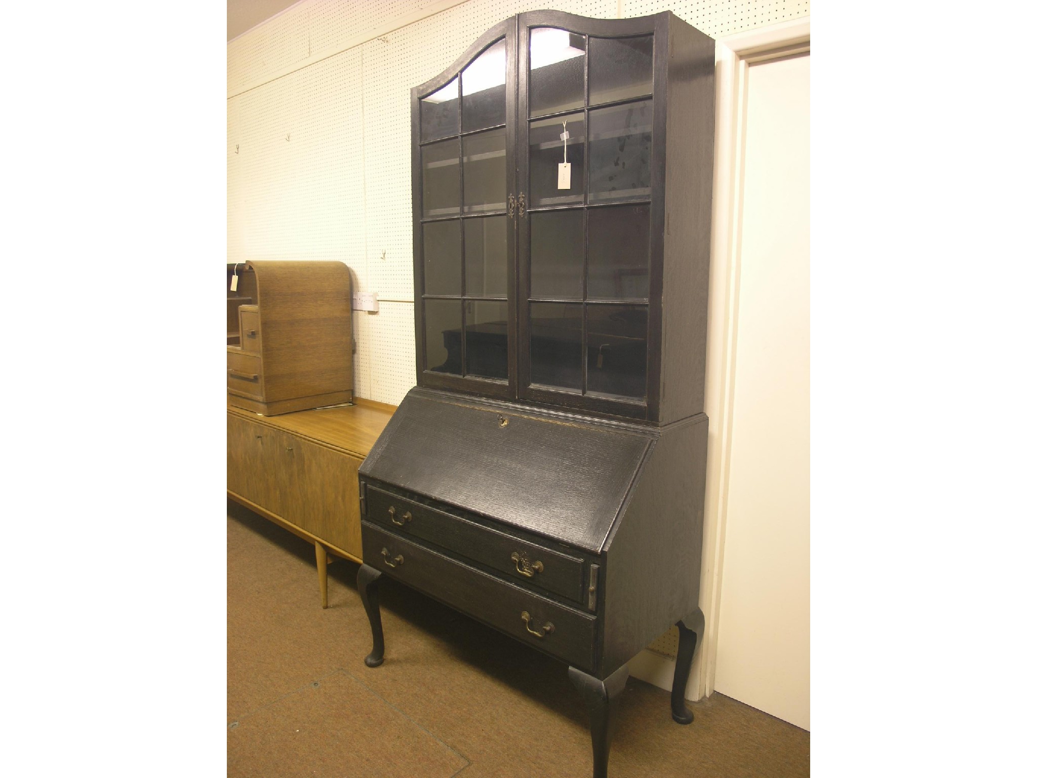 Appraisal: An early th century dark oak bureau bookcase arched bookcase