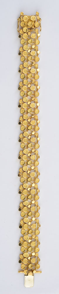 Appraisal: K GOLD MODERNIST BRACELET Pebble openwork strap in dwts Property