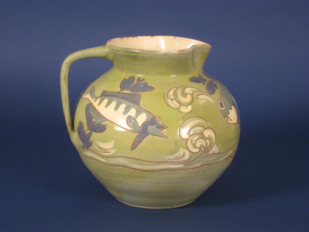 Appraisal: A large Brannan Barum pottery Jug moulded fish designs on